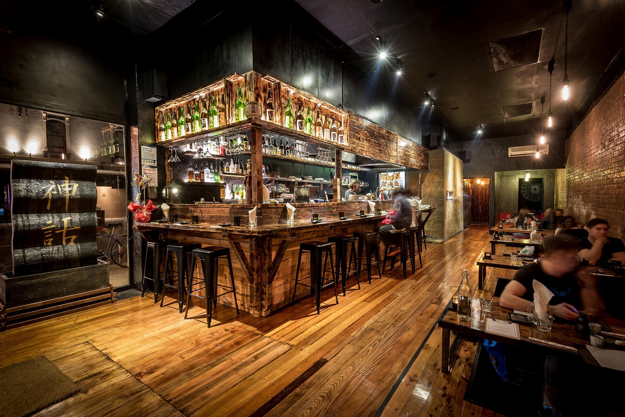 Warm timber bar and dining room at Shinwa Izakaya